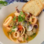 Anelli di calamari e vongole in guazzetto